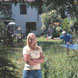 Debt Management image: Woman standing in sunny garden